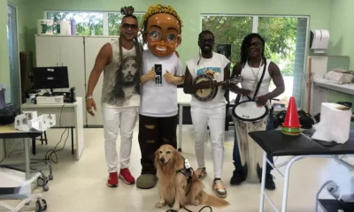 Cães terapeutas, acompanhados por música e muita alegria, percorreram os corredores da unidade, levando sorrisos e esperança